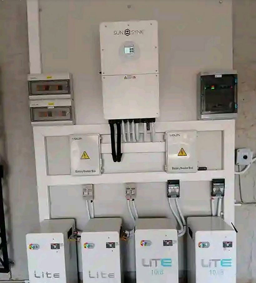 Sunsynk hybrid inverter above four Freedom Won Lite lithium batteries